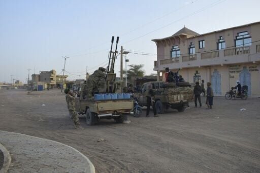 Tuareg rebels of the Azawad Liberation Front (FLA) ride on pickup trucks in Kidal after seizing the city in northern Mali