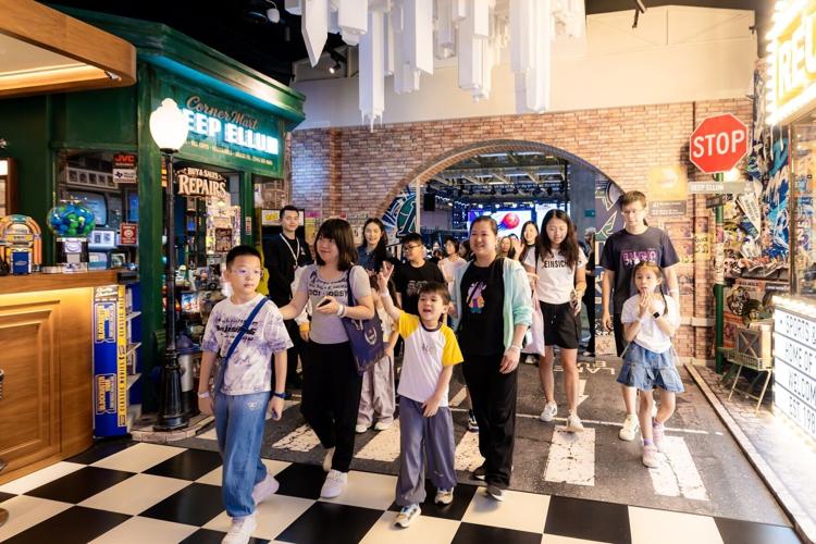 Sands Cares Ambassadors accompany families from local social service organisations to explore NBA HOUSE during the Community Basketball Carnival Sunday, where they enjoyed a range of interactive attractions and experiences.