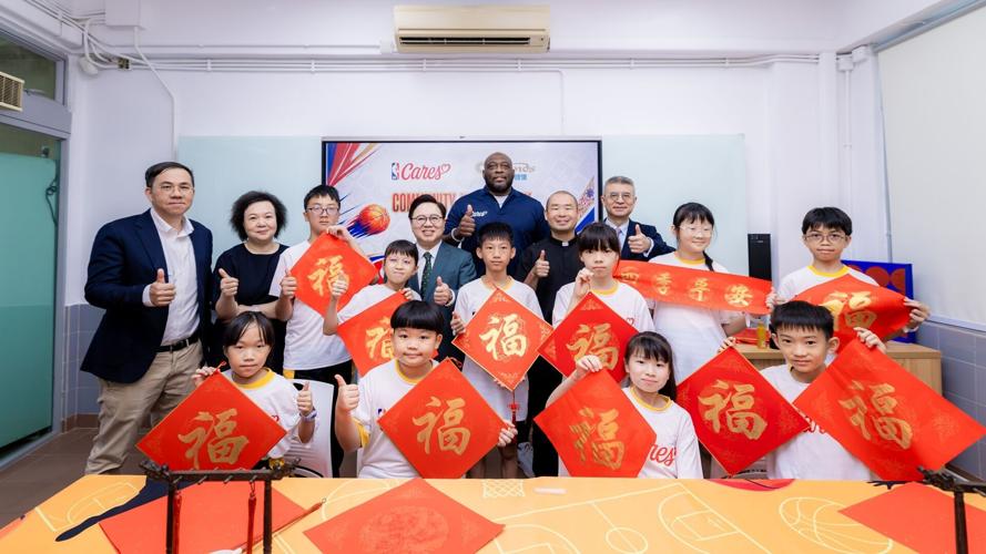 NBA legend Mitch Richmond and coaches engage with local students at Yuet Wah College, Macau Oct. 9 for a basketball clinic and a Chinese calligraphy experience on School Day, the third event of the Impact Week. The event offered students a valuable oppo...