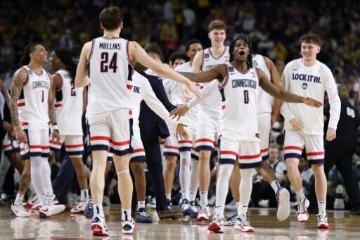Malachi Smith and Braylon Mullins of the University of Connecticut Huskies celebrate their NCAA Tournament Final Four victory over the University of Illinois