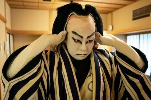 In kabuki, a wig serves to convey age, social status, occupation and personality