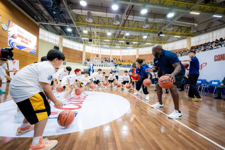 NBA legend Mitch Richmond and coaches engage with local students at Yuet Wah College, Macau Oct. 9 for a basketball clinic and a Chinese calligraphy experience on School Day, the third event of the Impact Week. The event offered students a valuable oppo...