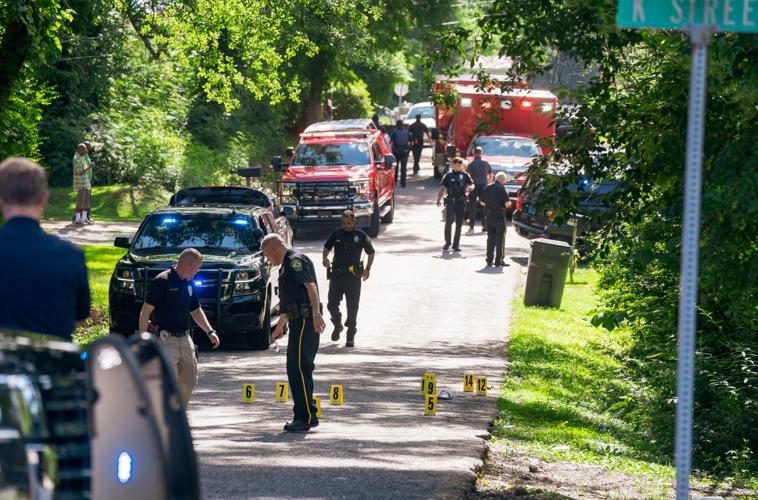Alexander City police officers work the scene of a shooting on N street