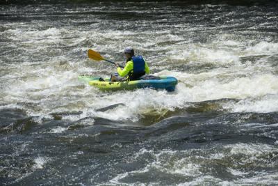 Cliff Williams / TPI A kayaker makes his way through Moccasin Gap Sunday on the Coosa River.