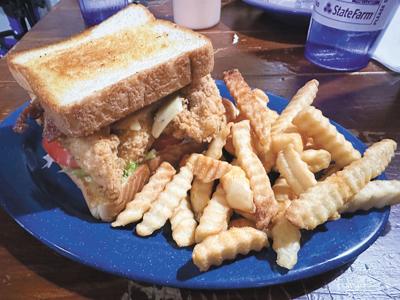 Enjoying a little chicken sandwich with family