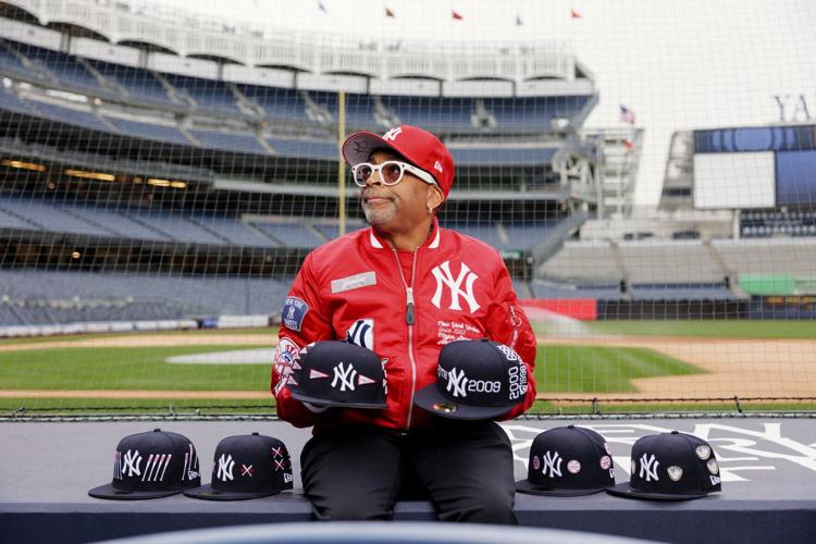 Spike Lee at Yankee Stadium showcasing his New Era x Spike Lee Limited-Edition Collection.