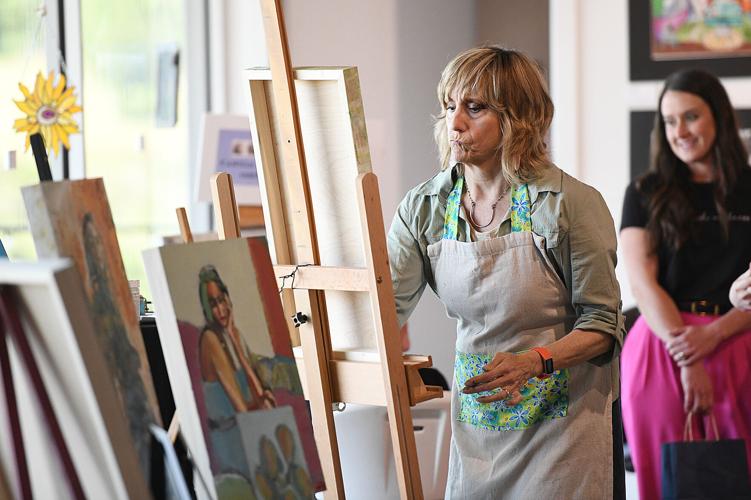 Cliff Williams / TPI Linda Lee paints in the gallery of The Kelly Fitzpatrick Center for the Arts.