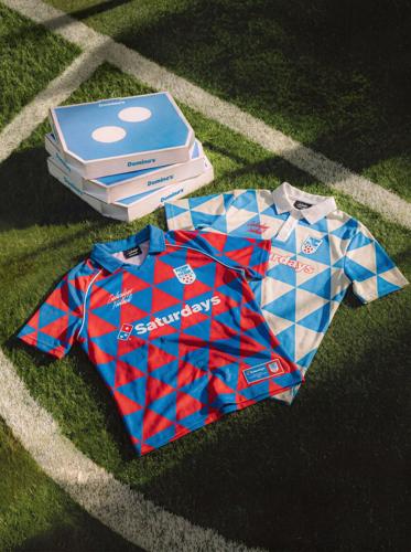 In celebration of the upcoming soccer matches, Domino’s has launched a limited-edition line of cobranded merchandise from Saturdays Football.