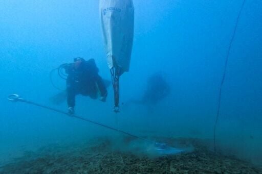 A diver instals one of the new eco-moorings in Porto Rafti bay near Athens