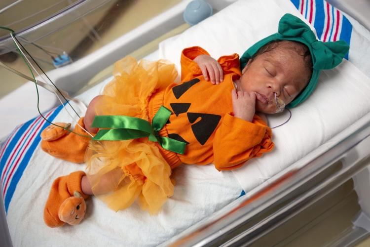 Babies in NICU don spooky outfits for Halloween