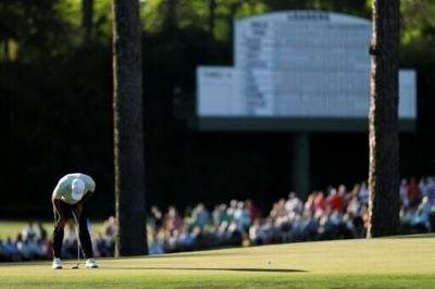 World number one Scottie Scheffler reacts after a missed putt on the 15th green during the first round of the 90th Masters
