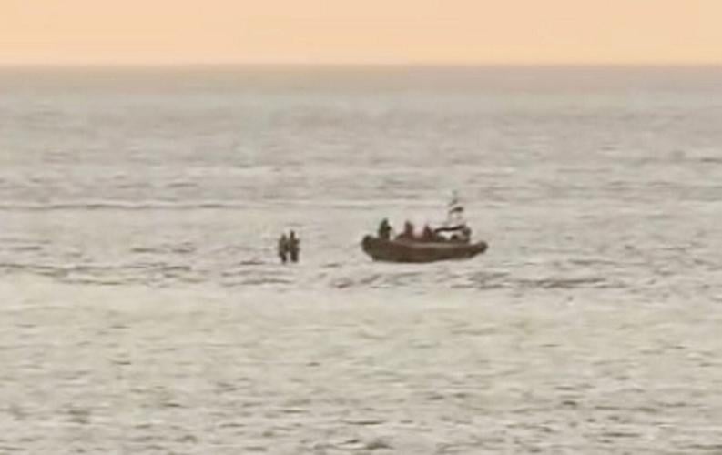 Boy dressed as Batman helps save man from rising tide after spotting frantic waving