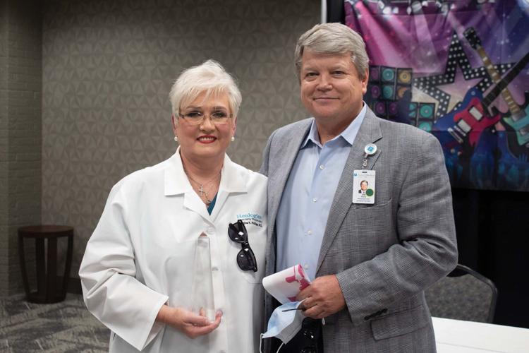 Russell Medical doctor honored during surprise party