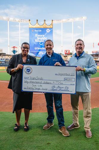 Sun Life and the Kansas City Royals present $50,000 to TeamSmile. (From left to right): Donease Smith, Executive Director, Urban Youth Academy, KC Royals Foundation; Ryan Bohrer, Vice President of Commercial Dental & Vision, Sun Life U.S.; and John McCa...