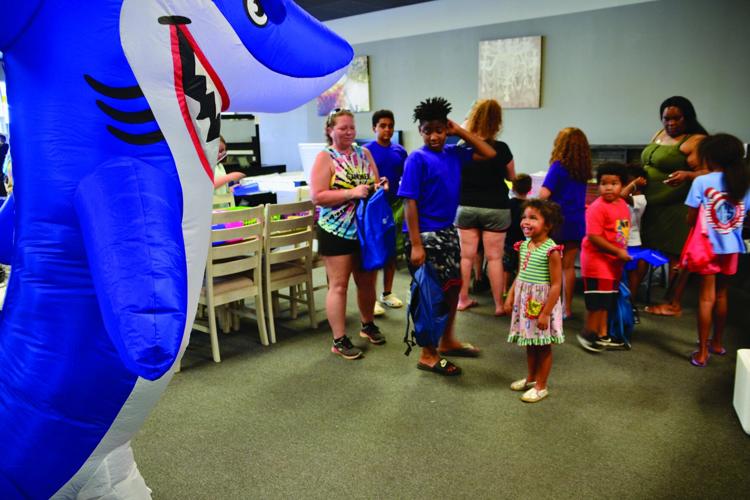 One Stop Furniture holds backpack giveaway