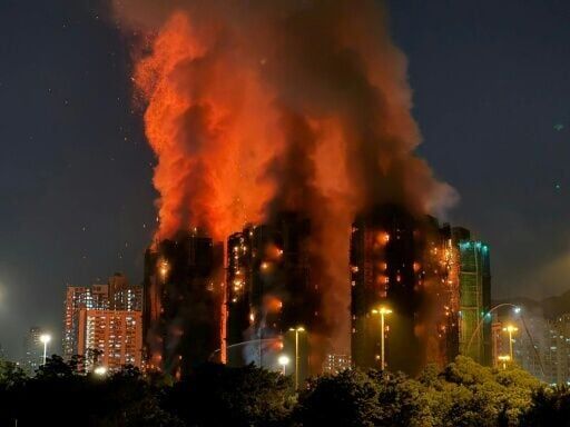 A major fire engulfs several apartment blocks in Hong Kong with at least 44 people killed