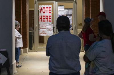 Cliff Williams / TPI Voters wait for the ballot tally to be posted on the window for the City of Wetumpka Municipal Election Runoff for City Council District 1.