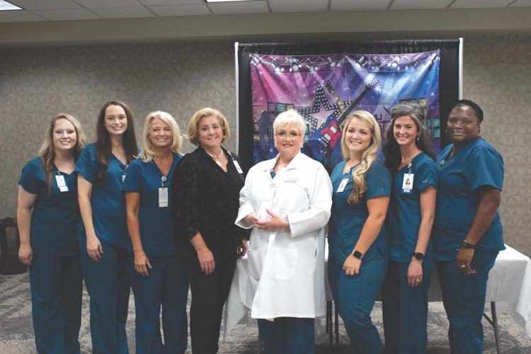 Russell Medical doctor honored during surprise party