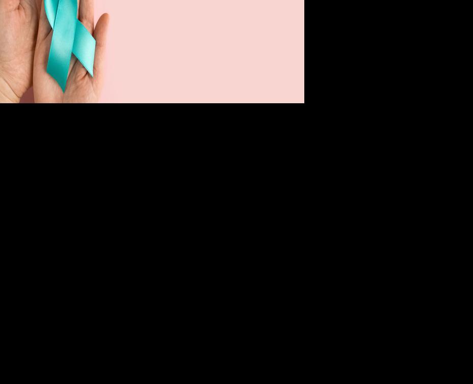 Woman holding Teal ribbon. Symbolic for cervical cancer, ovarian cancer, gynecological cancer and PCOS. And sexual assault awareness.