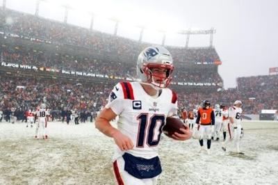 In 21 degrees F (-6 degrees C) conditions, the Patriots white uniforms were barely visible