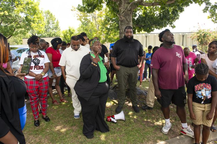 PHOTOS: Residents gather for murder victim and justice