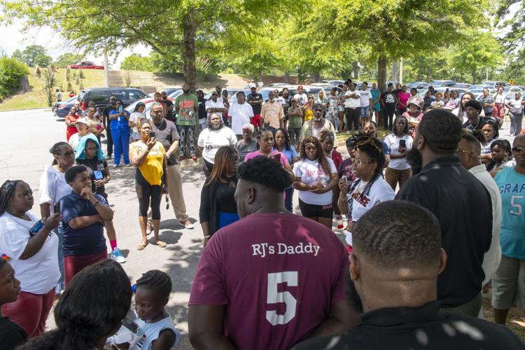 PHOTOS: Residents gather for murder victim and justice