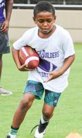 PHOTOS: Auburn players visit Bridge Builders youth football camp in Alex City