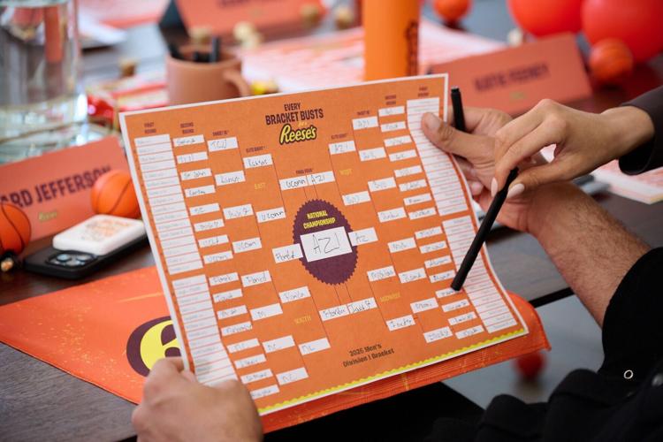 Richard Jefferson and Katie Feeney finalize their tournament picks during the Reese's Summit for "Every Bracket Busts for a Reese's"