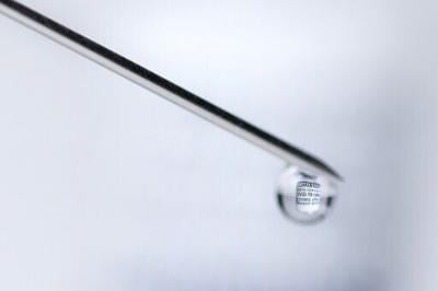 A syringe with a vial filled with Covid-19 vaccine. Negotiators have a week to complete the missing piece of the agreement