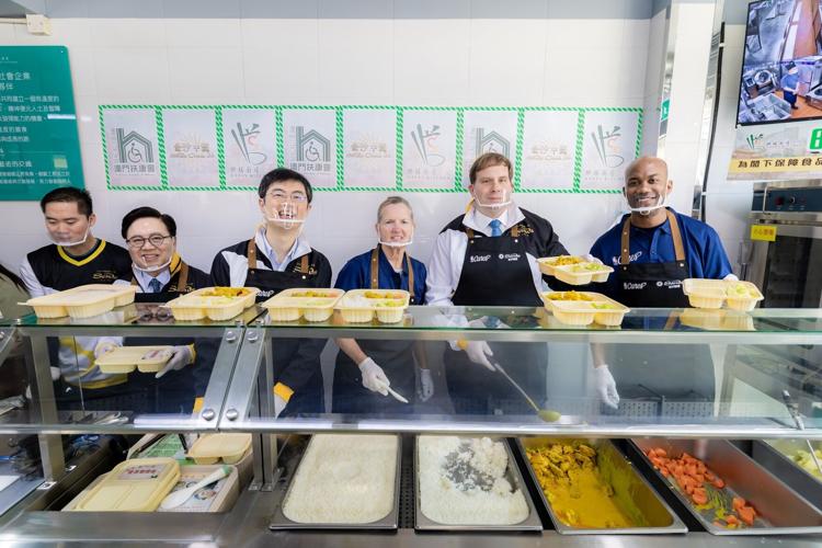 NBA legends Stephon Marbury and Cuttino Mobley, and executives from Las Vegas Sands and Sands China, prepare and distribute 200 boxed lunches to people in need in Macao Oct. 10 at the Happy Kitchen social enterprise for Health and Wellness Day, the four...