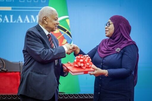 President Samia Suluhu Hassan (R) implied the violence was orchestrated by foreigners