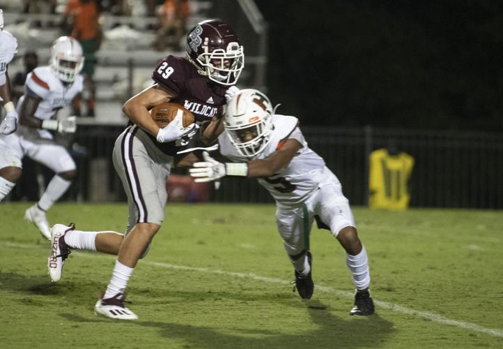 PHOTOS: Ben Russell hosts Huffman in the first game of the season