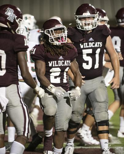 PHOTOS: Ben Russell hosts Huffman in the first game of the season