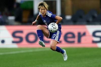 Maika Hamano of Japan controls the ball during the friendly with the United States