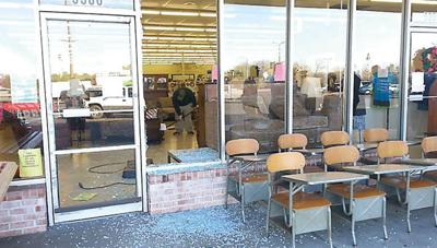 Deer crashes through Adullam House Thrift Store window