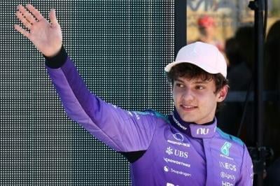 Mercedes' Italian teen driver Kimi Antonelli waves after winning the pole position during the qualifying session for the 2026 Miami Formula One Grand Prix