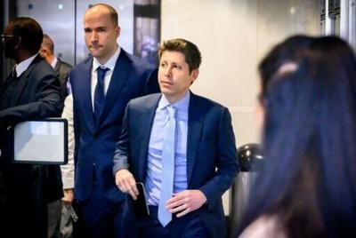 OpenAI CEO Sam Altman (R), here with co-founder Greg Brockman, has gone from being Musk's protege to a bitter rival