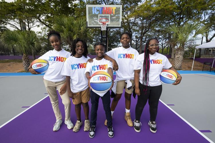 Members of the Belafonte TACOLCY Center proudly show off new swag from Unrivaled stars and Icy Hot Squad members, Napheesa Collier and Kate Martin, during a basketball clinic hosted at Icy Hot’s refurbished Comeback Court  on Wednesday, Feb. 18, 2026, i...
