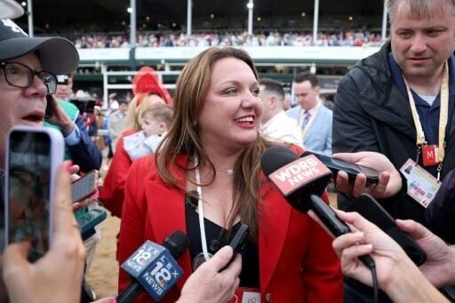 Cherie DeVaux, trainer of Golden Tempo, celebrates after becoming the first female trainer to win the Kentucky Derby