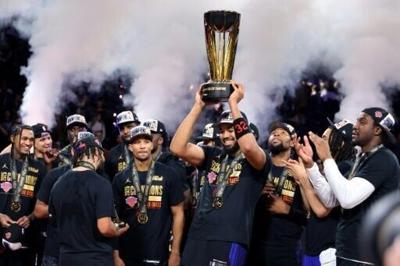 Karl-Anthony Towns celebrates the New York Knicks NBA Cup victory over the San Antonio Spurs