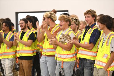 Cliff Williams / TPI Student applaud a speaker’s remarks at the ribbon cutting for the Academy Craft of Training in Montgomery.