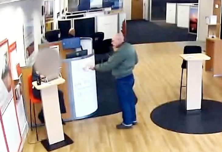 Bizarre moment man tries to rob bank armed with a vape