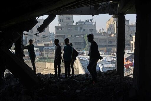 Palestinians inspected the debris of a damaged building in the Zeitoun neighbourhood of Gaza City, the day after a wave of Israeli air strikes