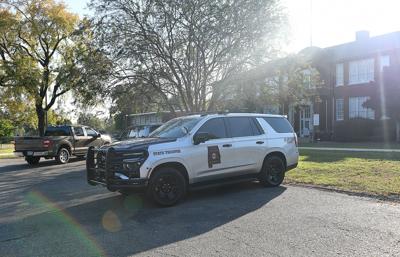 Cliff Williams / TPI Vehicles from the Alabama Law Enforcement Agency were parked outside the Tallassee City Hall Thursday and the building was locked to the public.