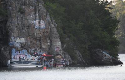 Cliff Williams / TPI First responders search the waters of Lake Martin at Chimney Rock after someone jumped off and didn’t resurface Wednesday afternoon.