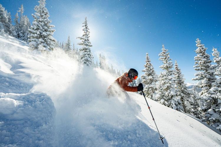 Skier in powder at Keystone.