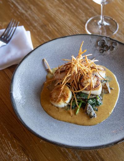 Seared Sea Scallops with sautéed spinach and mushrooms, carrot butter, fried potato