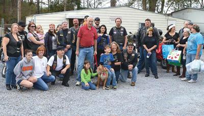 Louis Vuitton, area bikers spread holiday cheer at county humane shelter