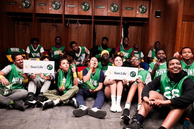 Middle schoolers from Boys and Girls Clubs of Southern Maine gather in the Celtics locker room at the Portland Expo to experience a "Day in the Life of a Player" as part of Sun Life's and the Maine Celtics' Fit to Win program.