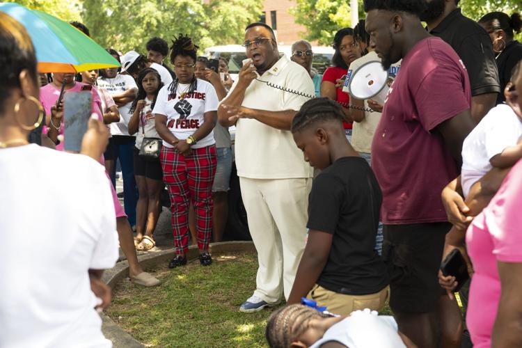 PHOTOS: Residents gather for murder victim and justice